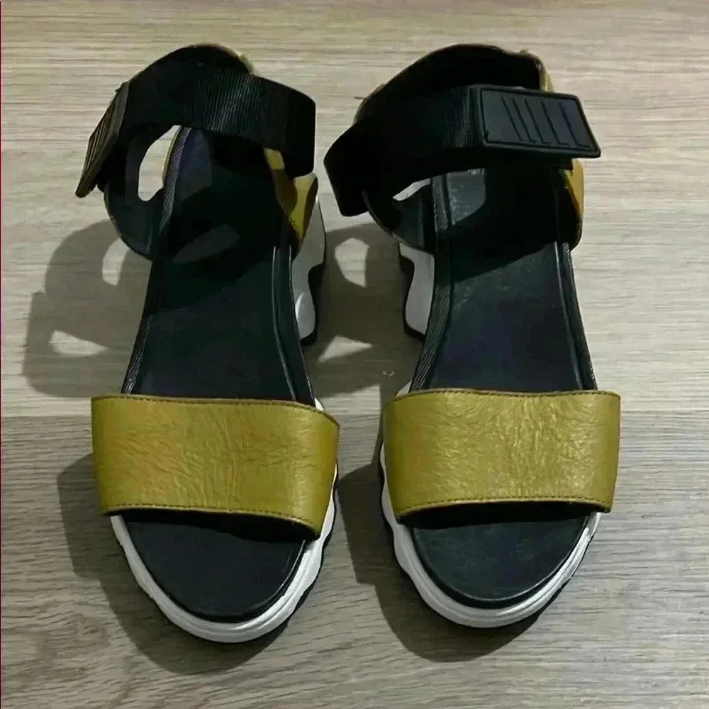 Sorel Black and Gold Sandals